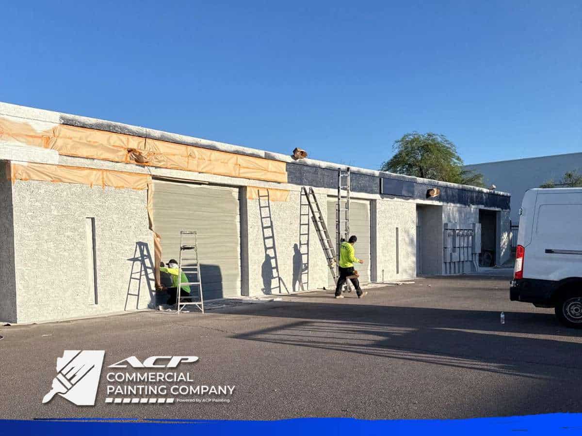 Workers Performing Commercial Painting on Building Exterior