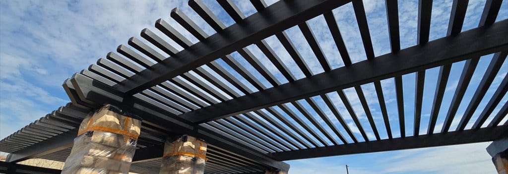 Community pergola with stone columns repainted by ACP Commercial Painting Company in Goodyear, AZ