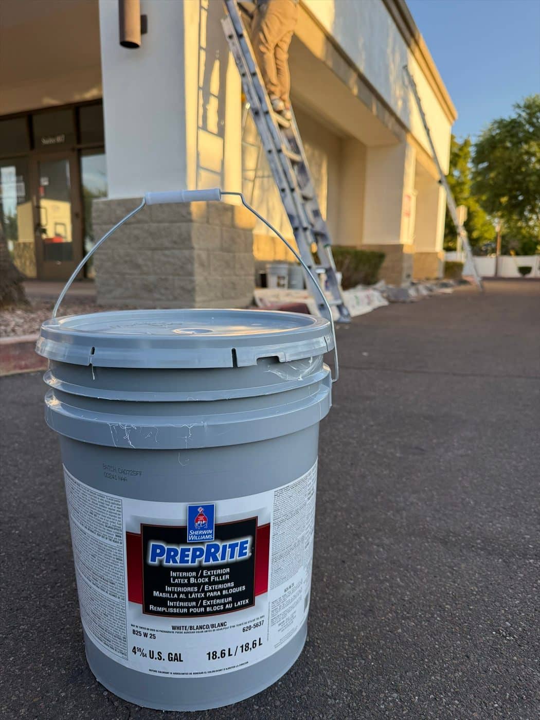 Sherwin-Williams PrepRite block filler bucket staged in front of the building.
