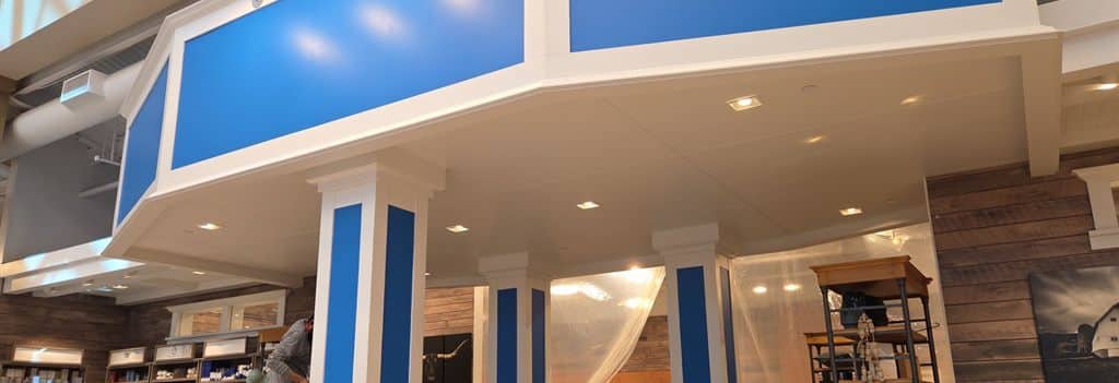 ACP Crew Repainting Retail Soffits And Columns Inside A Chandler, AZ Store