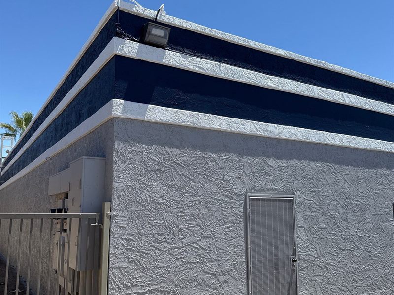 Industrial park building exterior repainted by ACP Commercial Painting Company in Phoenix, AZ