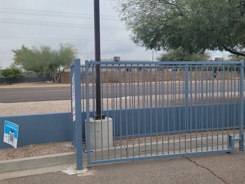 School campus motorized entry gate repainted by ACP Commercial Painting Company in Arizona