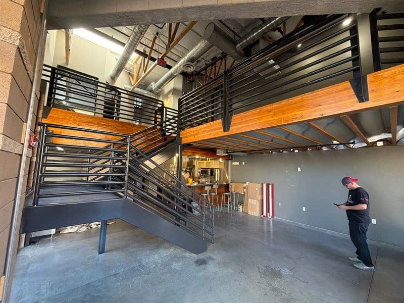 Interior staircase and mezzanine railings coated by ACP Commercial Painting Company in Scottsdale, AZ