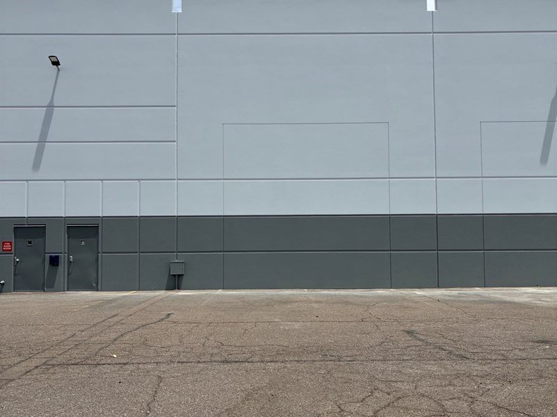 Two-tone warehouse wall repainted by ACP Commercial Painting Company in Chandler, AZ