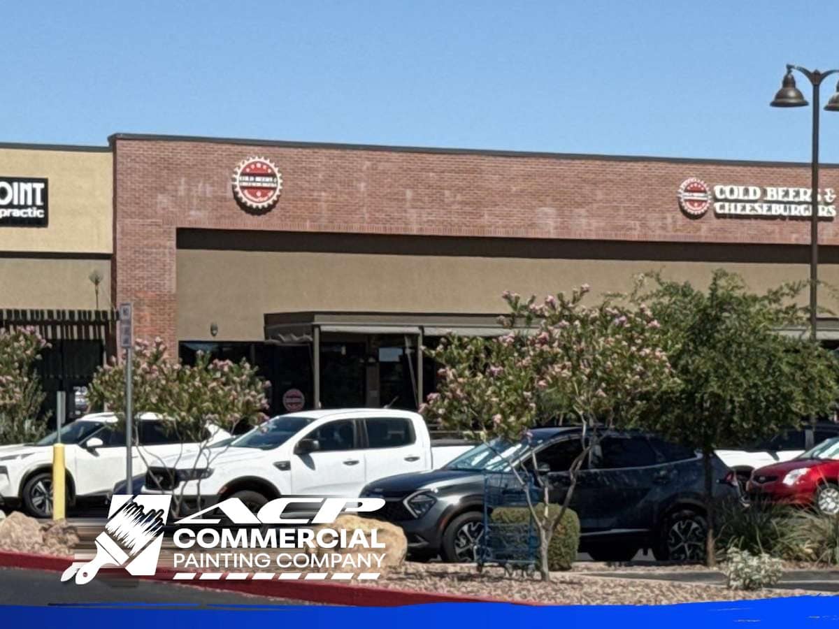 Arizona retail center storefront showing brand color under full desert sun, ACP Commercial Painting Company